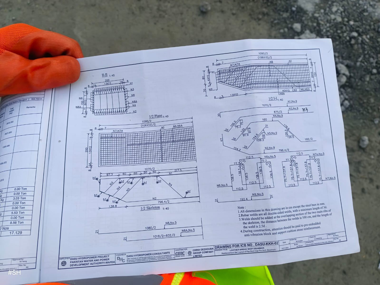 Site engineer reviewing shop drawings on site